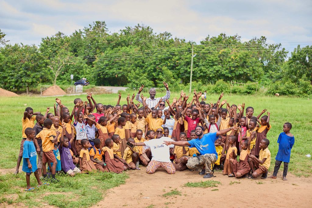 Group photo of the pupils, Headmaster and the Happy daffodils Team during our Needs Assessment  for the 'Operation Theory is not Enough' initiative at Adaklu Ahunda Kpodzi Basic School.